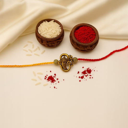 Golden Ganesha Motif on Red-Yellow Thread Rakhi